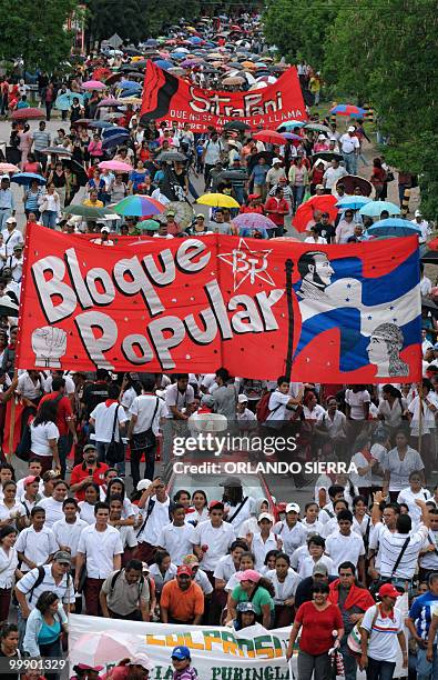 Honduran teachers, students and members of the National Front of Popular Resistance march in support of the teachers' statute, in Tegucigalpa, on May...