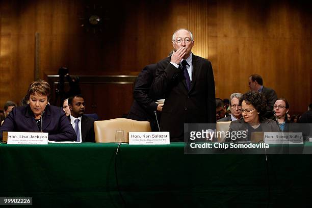 Secretary of the Interior Ken Salazar blows a kiss after arriving late for a Senate Environment and Public Works Committee hearing as Enviornmental...