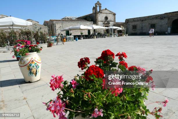 View of Marzamemi central square, a place where the Tv series based on Inspector Montalbano was filmed on June 05, 2018 in Marzamemi, Syracuse,...