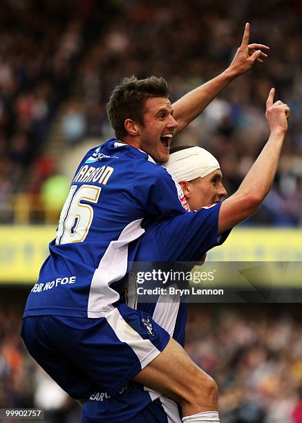 Steve Morison of Millwall celebrates with team mate Scott Barron after scoring during the League One Playoff Semi Final 2nd Leg between Millwall and...