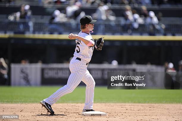 Gordon Beckham of the Chicago White Sox throws the ball to first base against the Toronto Blue Jays on May 9, 2010 at U.S. Cellular Field in Chicago,...