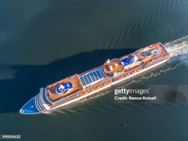 arcadia cruiser ship passing by in the stockholm swedish archipelago - remus kotsell stock pictures, royalty-free photos & images