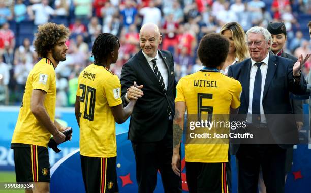 President Gianni Infantino and President of Royal Belgian Football Association Gerard Linard give medals to Marouane Fellaini, Dedryck Boyata, Axel...