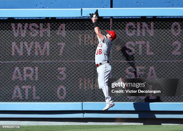 Kole Calhoun of the Los Angeles Angels of Anaheim makes the jumping catch on a fly ball to the right field wall during the first inning of the MLB...