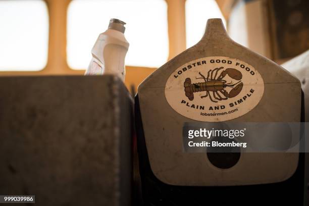 Sticker is displayed on a cooler in a boat off the coast of Plymouth, Massachusetts, U.S., on Tuesday, July 10, 2018. The proposed tariffs between...