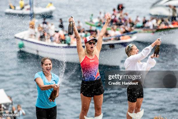 In this handout image provided by Red Bull, Adriana Jimenez of Mexico, Rhiannan Iffland of Australia and Lysanne Richard of Canada celebrate on the...