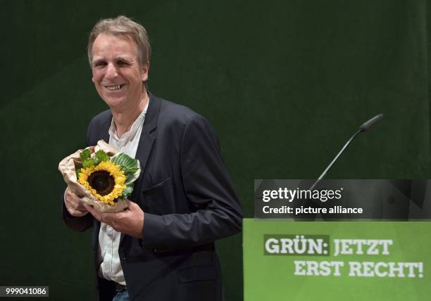 Lower Saxony's Minister of Environment and top candidate Stefan Wenzel stands on stage during the conference of state delegates of the Lower Saxony's...