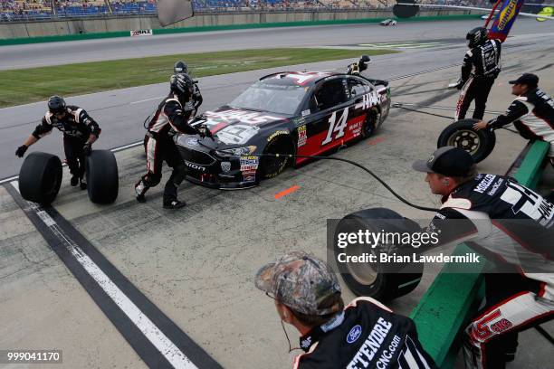 Clint Bowyer, driver of the Haas 30 Years of the VF1 Ford, pits during the Monster Energy NASCAR Cup Series Quaker State 400 presented by Walmart at...