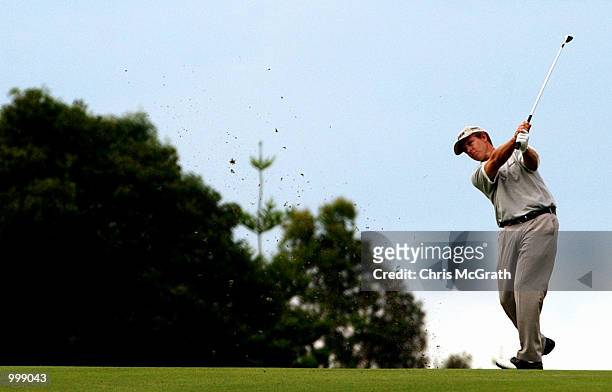 Scott Laycock of Australia hits his approach shot to the third hole during the final round of the Holden Australian Open Golf Tournament held at The...