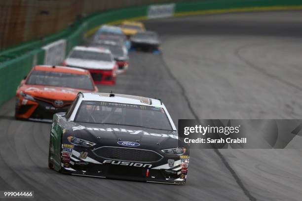 Aric Almirola, driver of the Smithfield Ford, leads a pack of cars during the Monster Energy NASCAR Cup Series Quaker State 400 presented by Walmart...