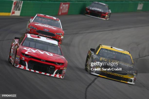 Austin Dillon, driver of the AAA Chevrolet, races Matt Kenseth, driver of the Performance Plus Motor Oil Ford, during the Monster Energy NASCAR Cup...