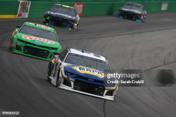 Chase Elliott, driver of the NAPA Auto Parts Chevrolet, leads a pack of cars during the Monster Energy NASCAR Cup Series Quaker State 400 presented...