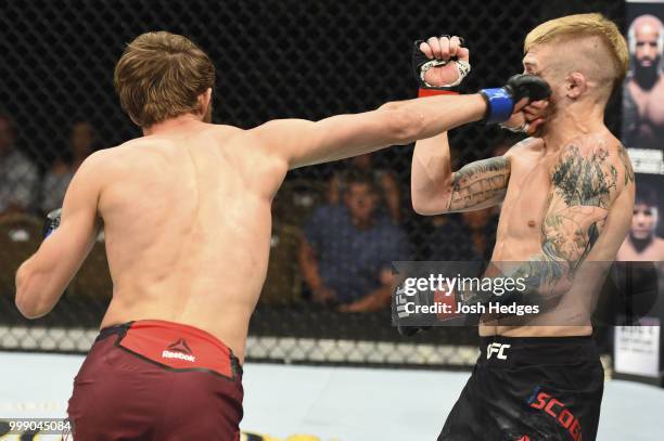 Said Nurmagomedov of Russia punches Justin Scoggins in their flyweight fight during the UFC Fight Night event inside CenturyLink Arena on July 14,...