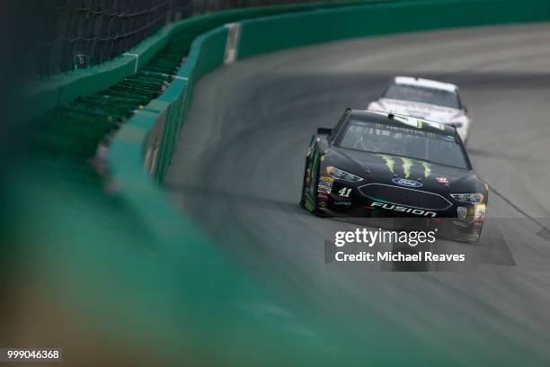 Kurt Busch, driver of the Monster Energy/Haas Automation Ford, leads a pack of cars during the Monster Energy NASCAR Cup Series Quaker State 400...