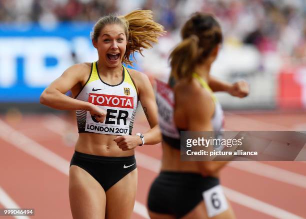 German athletes Gina Lückenkemper and Rebekka Haase celebrate after competing in the 4 x 400 metre relay race event at the IAAF World Championships...