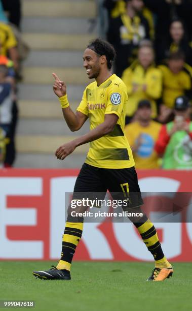 Dortmund's Pierre Aubameyang celebrates after giving his side a 3:0 lead during the German Soccer Association Cup first-round soccer match between 1....