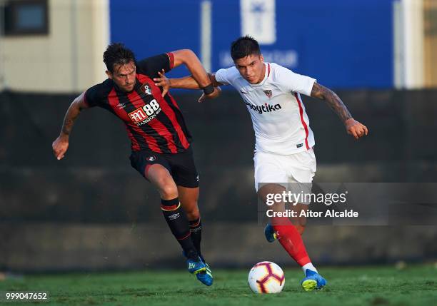 Joaquin Correa of Sevilla FC duels for the ball with Charlie Daniels of AFC Bournemouth during Pre- Season friendly Match between Sevilla FC and AFC...