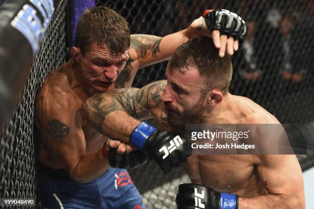 Alexander Volkanovski of Australia elbows Darren Elkins in their featherweight fight during the UFC Fight Night event inside CenturyLink Arena on...