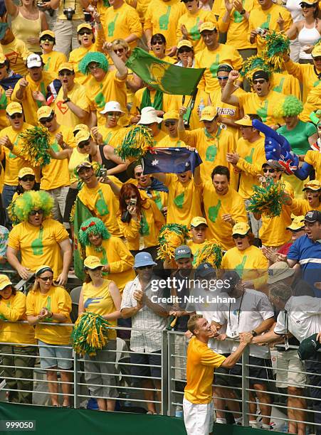 Lleyton Hewitt of Australia celebrates his victory over Thomas Johansson of Sweden with the Australian Fanatics on day three of the Davis Cup semi...