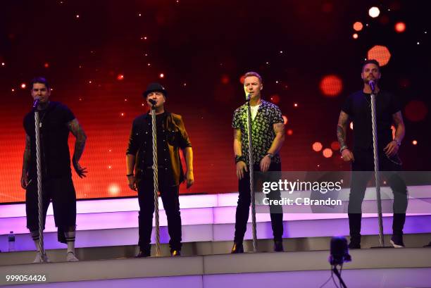 Mikey Graham, Shane Lynch, Ronan Keating and Keith Duffy of Boyzone perform on stage at Kew The Music at Kew Gardens on July 14, 2018 in London,...