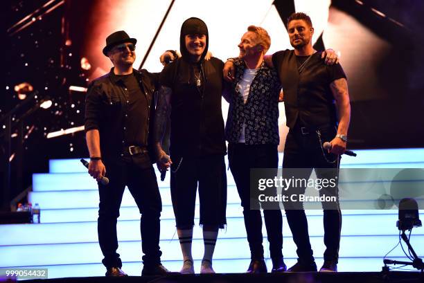 Mikey Graham, Shane Lynch, Ronan Keating and Keith Duffy of Boyzone perform on stage at Kew The Music at Kew Gardens on July 14, 2018 in London,...