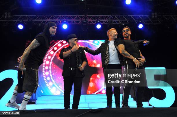 Mikey Graham, Shane Lynch, Ronan Keating and Keith Duffy of Boyzone perform on stage at Kew The Music at Kew Gardens on July 14, 2018 in London,...