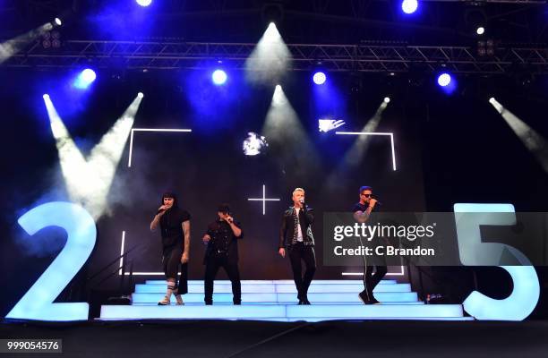 Mikey Graham, Shane Lynch, Ronan Keating and Keith Duffy of Boyzone perform on stage at Kew The Music at Kew Gardens on July 14, 2018 in London,...