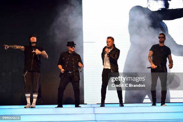 Mikey Graham, Shane Lynch, Ronan Keating and Keith Duffy of Boyzone perform on stage at Kew The Music at Kew Gardens on July 14, 2018 in London,...