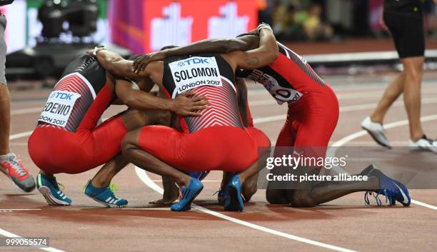 The Trinidad and Tobago team gathering together after their victory at the men's 4 x 400 meter relay at the IAAF London 2017 World Athletics...