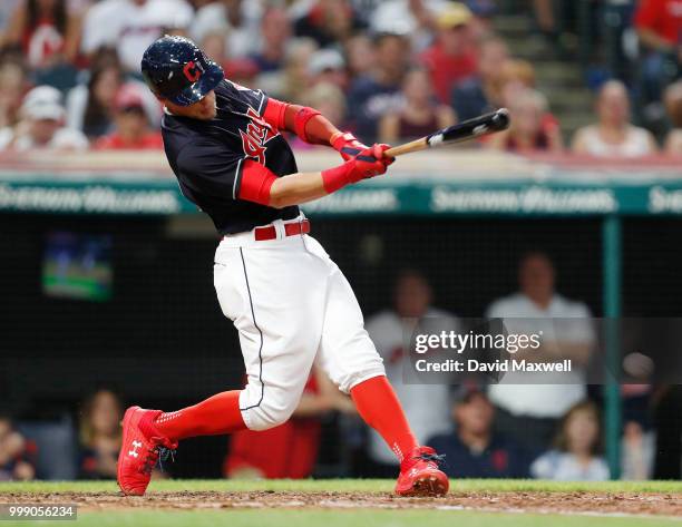 Brandon Guyer of the Cleveland Indians hits an RBI single to score Jose Ramirez against the New York Yankees in the sixth inning at Progressive Field...