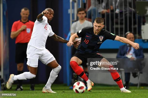Ante Rebic of Croatia and Ashley Young of England compete for the ball during the 2018 FIFA World Cup Russia Semi Final match between England and...
