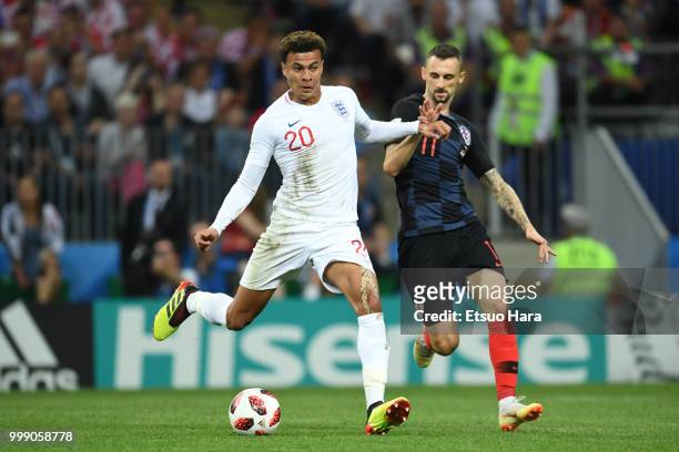 Dele Alli of England and Marcelo Brozovic of Croatia compete for the ball during the 2018 FIFA World Cup Russia Semi Final match between England and...