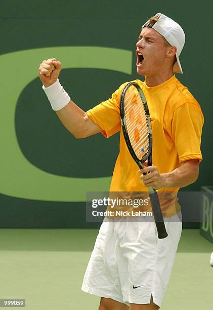 Lleyton Hewitt of Australia celebrates winning a point against Thomas Johansson of Sweden on day three of the Davis Cup semi final between Australia...