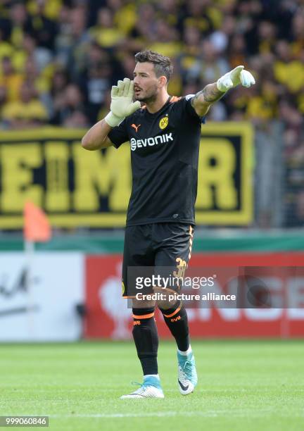 Dortmund's goalkeeper Roman Bürki gives instructions during the German Soccer Association Cup first-round soccer match between 1. FC...