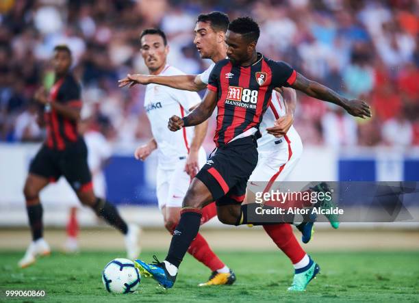 Borja San Emeterio of Sevilla FC duels for the ball with Jermain Defoe of AFC Bournemouth during Pre- Season friendly Match between Sevilla FC and...
