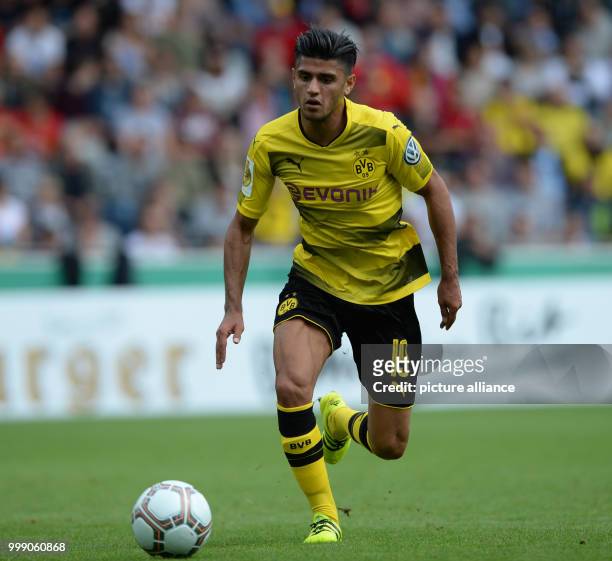 Dortmund's Mahmoud Dahoud runs with the ball during the German Soccer Association Cup first-round soccer match between 1. FC Rielasingen-Arlen and...