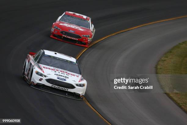 Brad Keselowski, driver of the Discount Tire Ford, races during the Monster Energy NASCAR Cup Series Quaker State 400 presented by Walmart at...