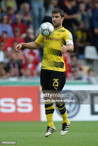 Dortmund's Sokratis controls the ball with his chest during the German Soccer Association Cup first-round soccer match between 1. FC...