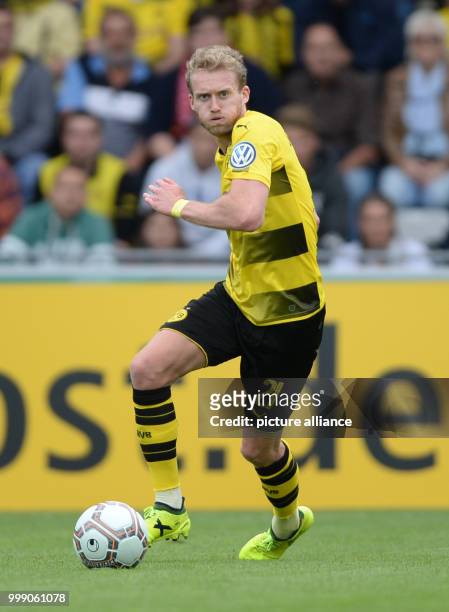 Dortmund's Andre Schürrle runs with the ball during the German Soccer Association Cup first-round soccer match between 1. FC Rielasingen-Arlen and...