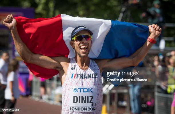 French athlete Yohann Diniz celebrates after competing in the 50 kilometer marathon at the IAAF London 2017 World Athletics Championships in London,...