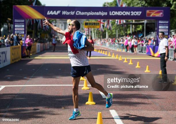French athlete Yohann Diniz celebrates after competing in the 50 kilometer marathon at the IAAF London 2017 World Athletics Championships in London,...