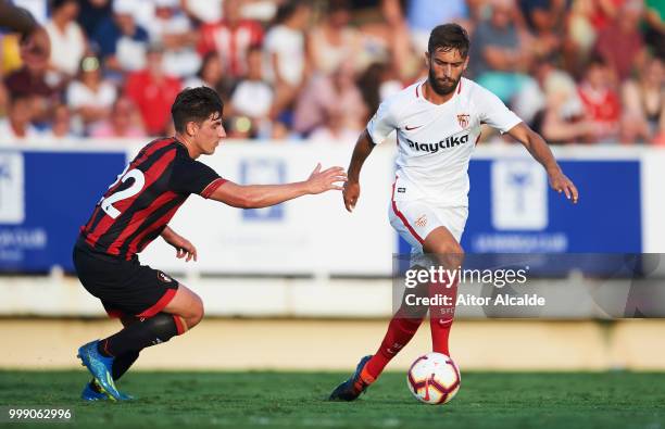 JesUs Crespo 'Pejino' of Sevilla FC duels for the ball with Emerson Hyndman of AFC Bournemouth during Pre- Season friendly Match between Sevilla FC...