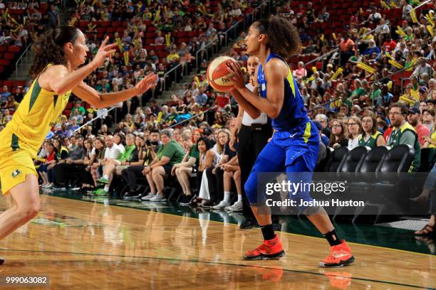 Skylar Diggins-Smith of the Dallas Wings passes the ball during the game against the Seattle Storm on July 14, 2018 at Key Arena in Seattle,...