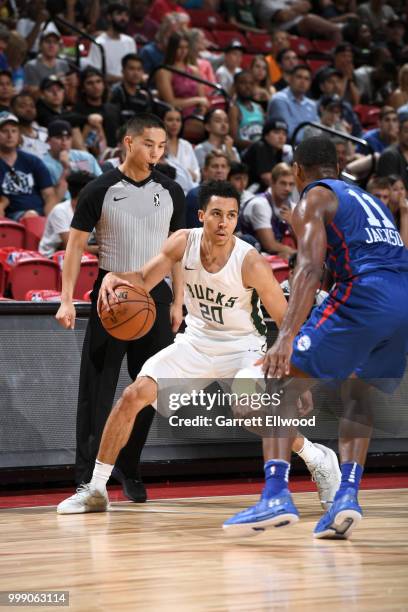 Travis Trice II of the Milwaukee Bucks handles the ball against the Philadelphia 76ers during the 2018 Las Vegas Summer League on July 14, 2018 at...