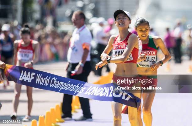 Chinese athlete Yang Jiayu finishes first ahead of Mexican athlete Maria Guadalupe Gonzalez in the 20 kilometre marathon at the IAAF London 2017...