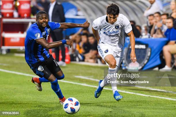 San Jose Earthquakes midfielder Shea Salinas kicks the ball before Montreal Impact midfielder Raheem Edwards reaches him during the San Jose...