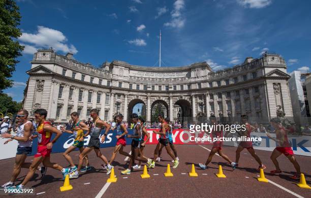 Athletes competing in the 20 kilometre marathon at the IAAF London 2017 World Athletics Championships run past Buckinham Palace in London, United...