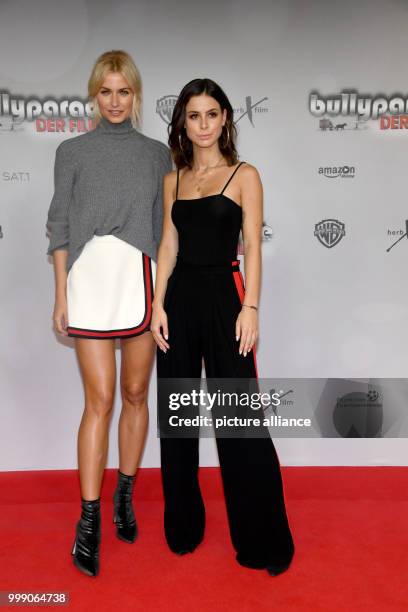 Model Lena Gercke and singer Lena Meyer-Landrut attend the film premiere of their film 'Bullyparade - Der Film' at the Mathaeser Filmpalast in...