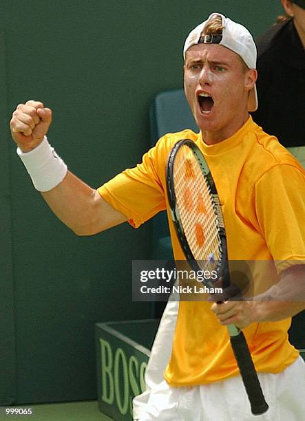 Lleyton Hewitt of Australia celebrates winning a point against Thomas Johansson of Sweden on day three of the Davis Cup semi final between Australia...