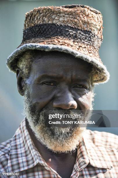 Man poses for a picture in one of the finished leather hats made out of tanned fish pelts on June 11 at the Alisam Product Development, a mini...